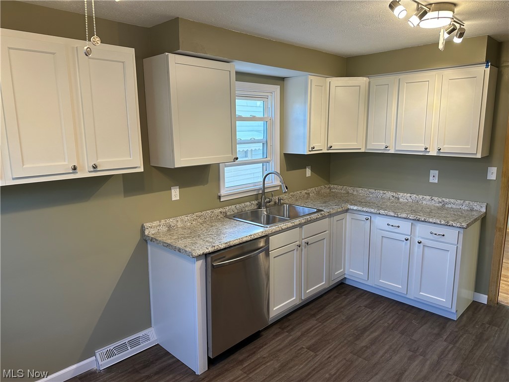 20626 Centuryway Road Maple Heights, OH 44137 - Photo 7 of 15 Kitchen with white cabinets, sink, and dishwasher