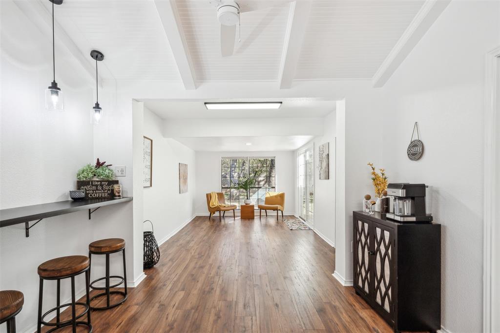 215 Shady Oak Road Keene, TX 76059 - Photo 13 of 26 a view of a room with furniture and wooden floor