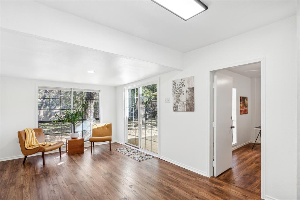 215 Shady Oak Road Keene, TX 76059 - Photo 14 of 26 a living room with furniture and wooden floor