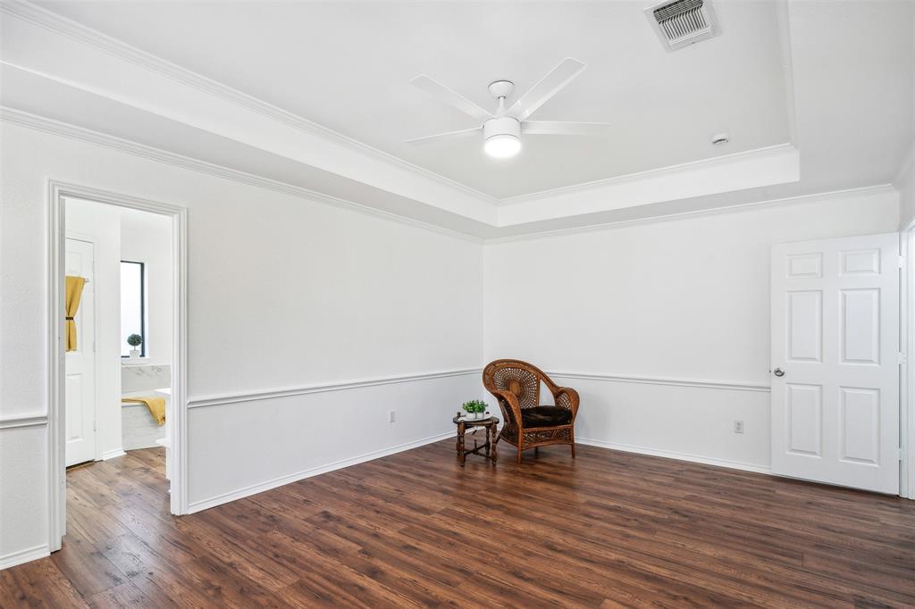 215 Shady Oak Road Keene, TX 76059 - Photo 17 of 26 an empty room with wooden floor and windows