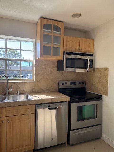 7625 Shalimar Street Miramar, FL 33023 - Photo 11 of 38 a kitchen with stainless steel appliances a stove microwave and sink
