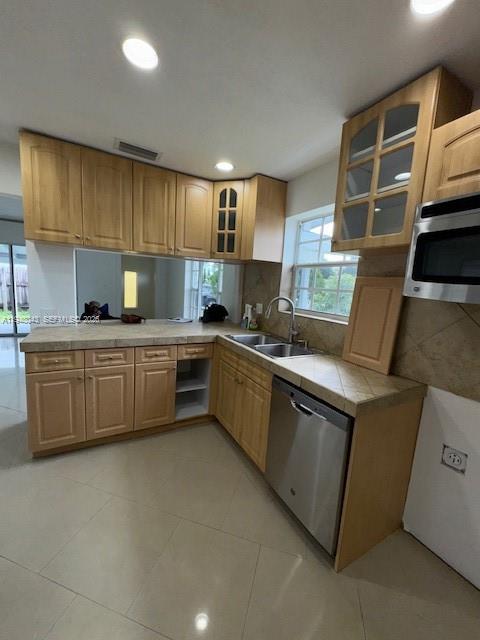 7625 Shalimar Street Miramar, FL 33023 - Photo 12 of 38 a kitchen with a sink and a stove top oven