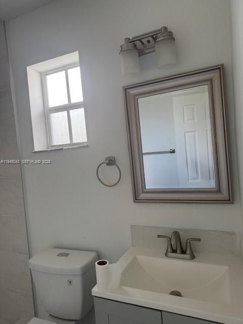 7625 Shalimar Street Miramar, FL 33023 - Photo 22 of 38 a bathroom with a toilet sink and mirror