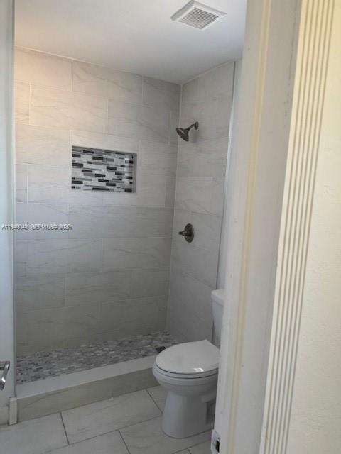7625 Shalimar Street Miramar, FL 33023 - Photo 23 of 38 a bathroom with a shower and a toilet