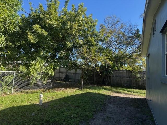 7625 Shalimar Street Miramar, FL 33023 - Photo 30 of 38 a view of a backyard with large trees