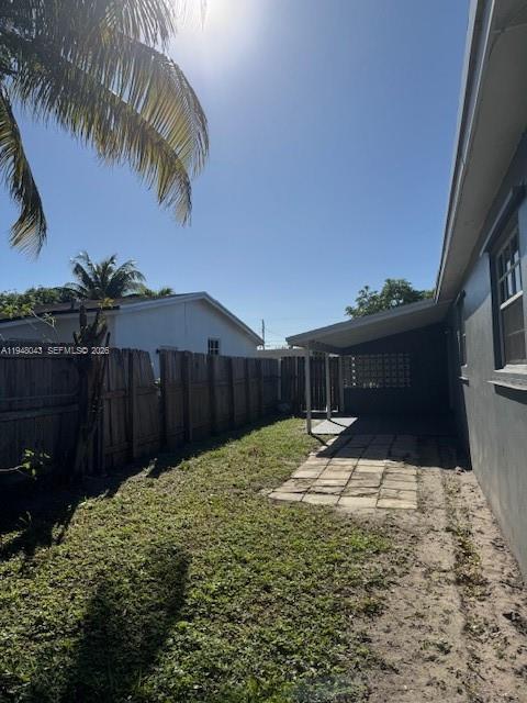 7625 Shalimar Street Miramar, FL 33023 - Photo 32 of 38 a backyard of a house with table and chairs