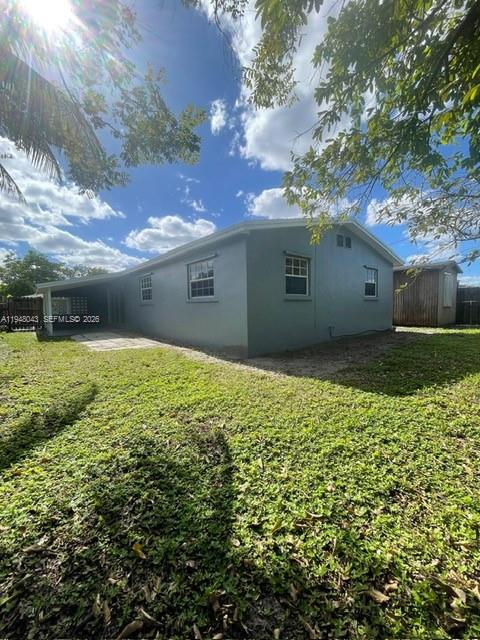 7625 Shalimar Street Miramar, FL 33023 - Photo 38 of 38 a view of a big yard with potted plants