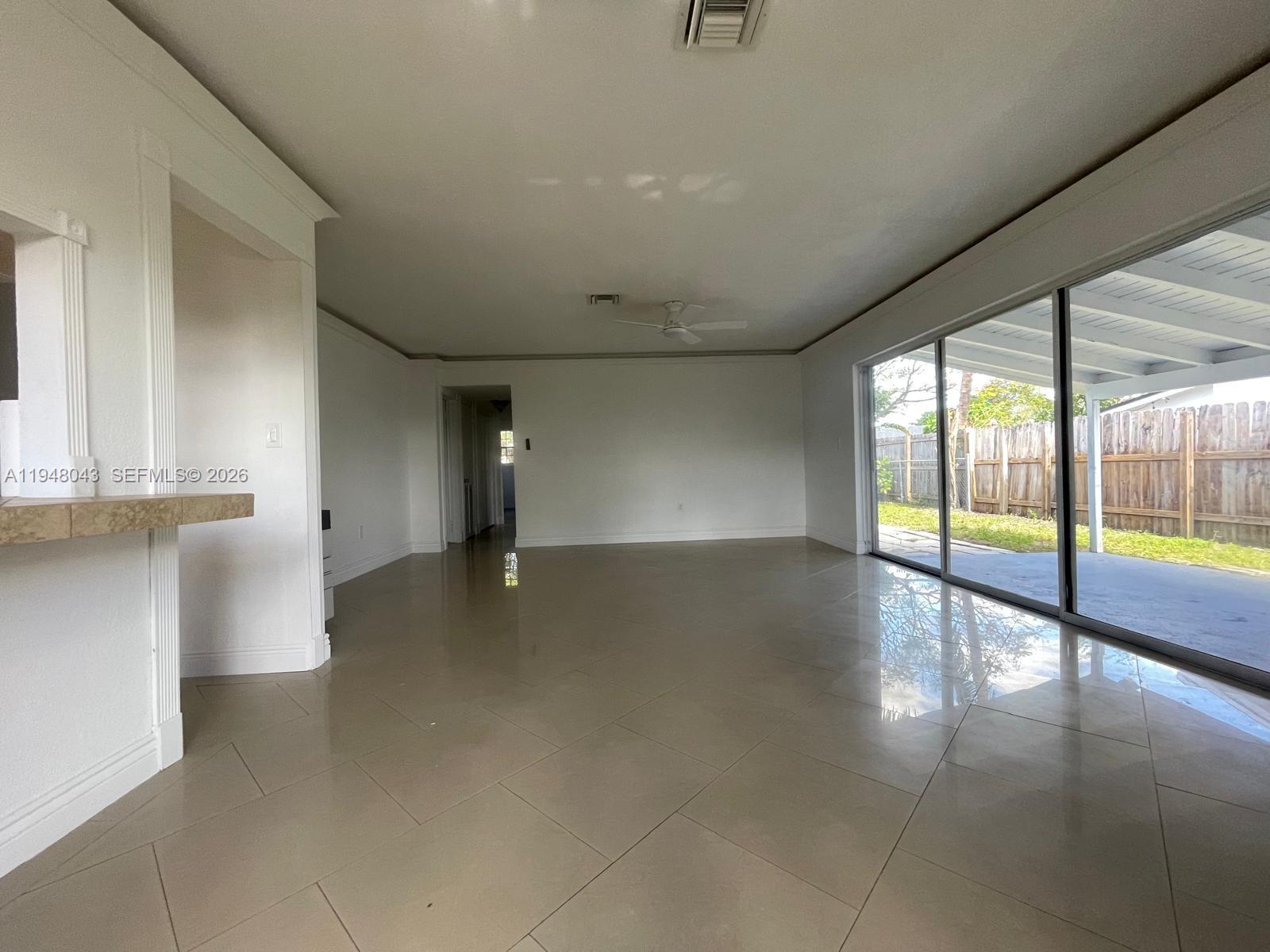 7625 Shalimar Street Miramar, FL 33023 - Photo 6 of 38 a view of an empty room with a window