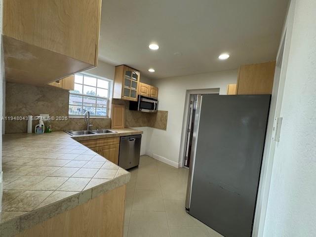 7625 Shalimar Street Miramar, FL 33023 - Photo 9 of 38 a kitchen with stainless steel appliances a refrigerator and a sink