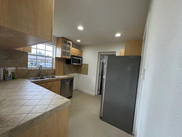 7625 Shalimar Street Miramar, FL 33023 - Photo 10 of 38 a kitchen with stainless steel appliances a refrigerator and a stove