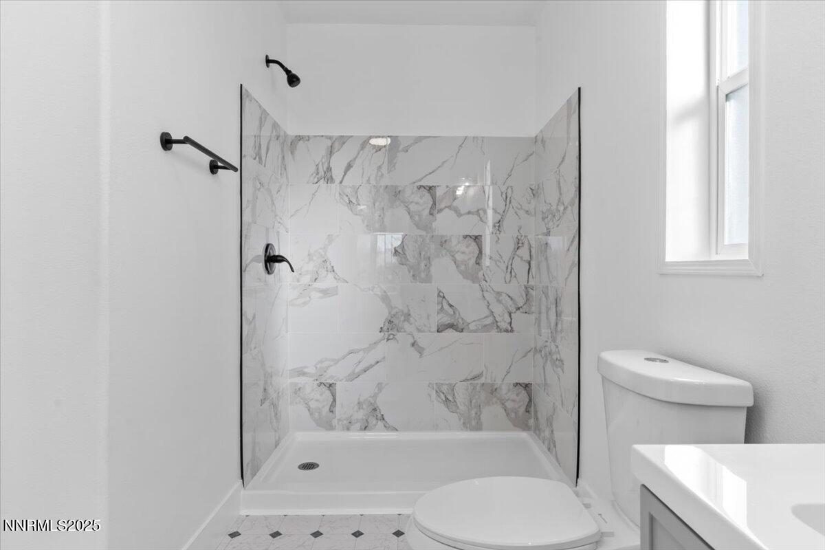 11305 Fir Drive Reno, NV 89506 - Photo 16 of 35 a bathroom with a toilet and a shower