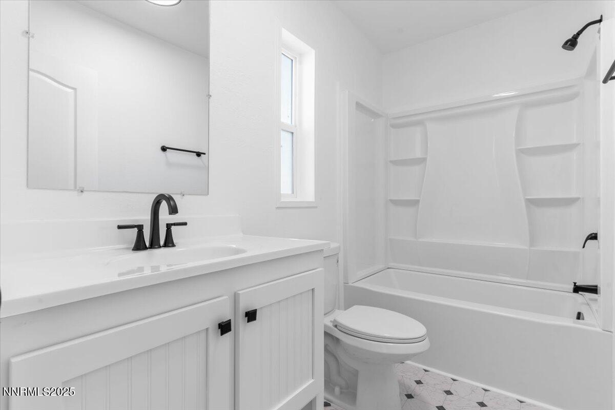 11305 Fir Drive Reno, NV 89506 - Photo 21 of 35 a bathroom with a sink a toilet and a bathtub