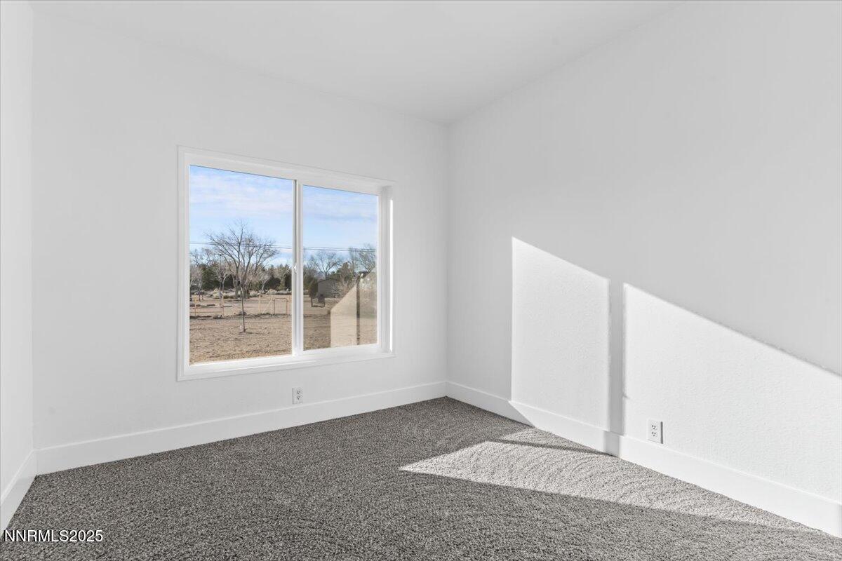 11305 Fir Drive Reno, NV 89506 - Photo 32 of 35 a view of an empty room with a window