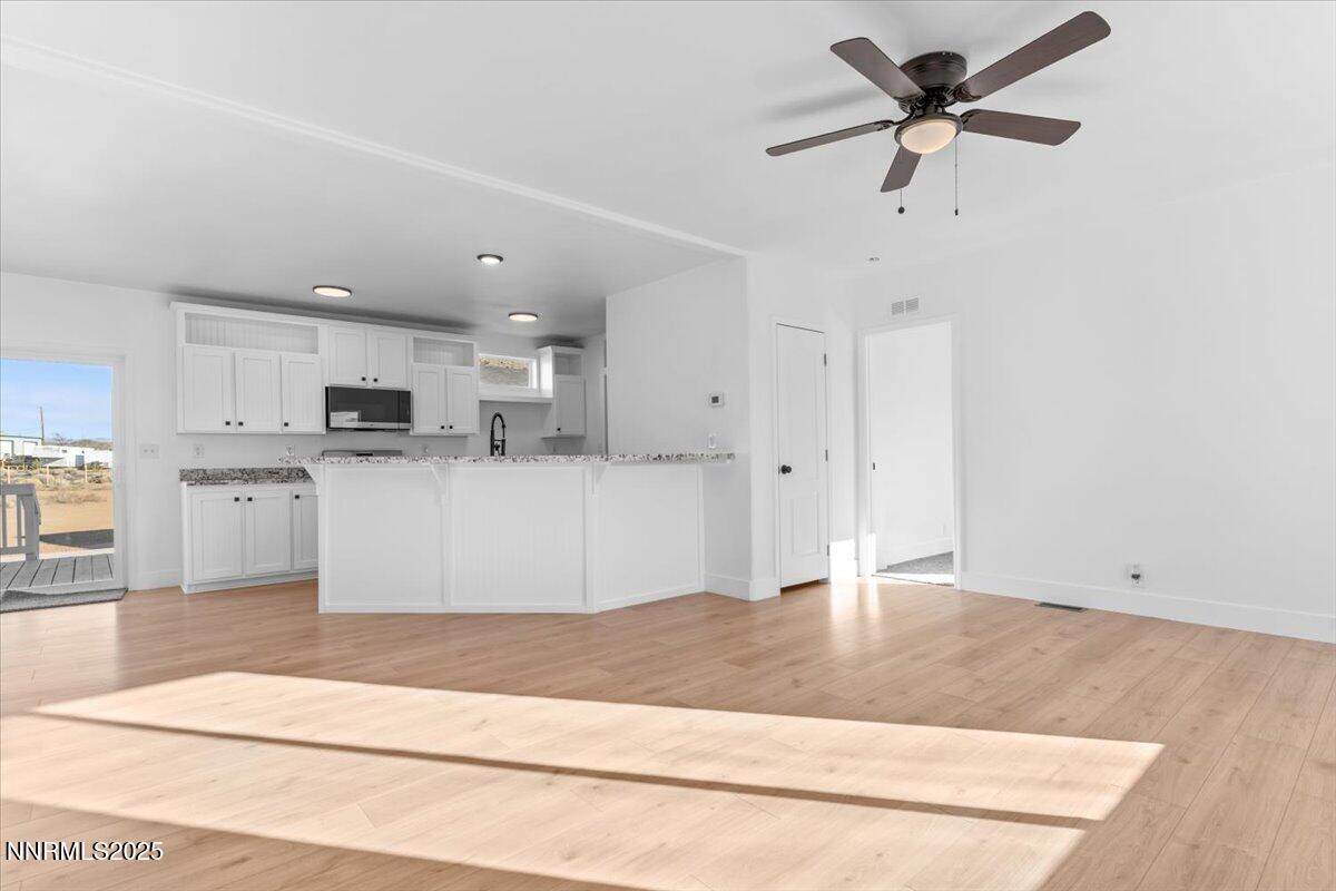 11305 Fir Drive Reno, NV 89506 - Photo 5 of 35 a view of a kitchen with microwave and cabinets