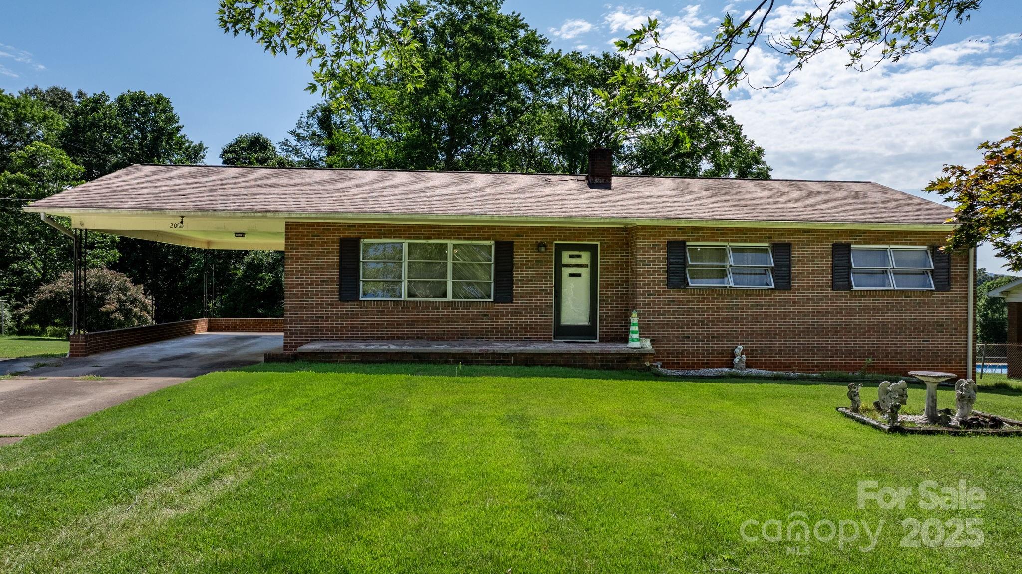 a view of a house with a backyard porch and sitting area