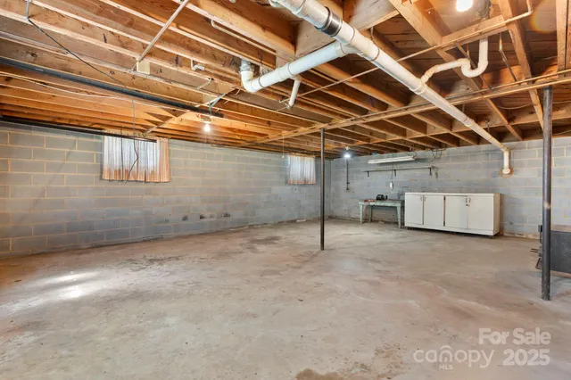 a view of a room with wooden walls