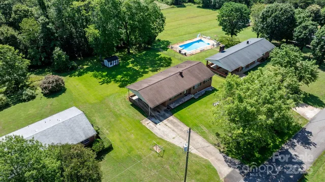 a view of a park with large trees