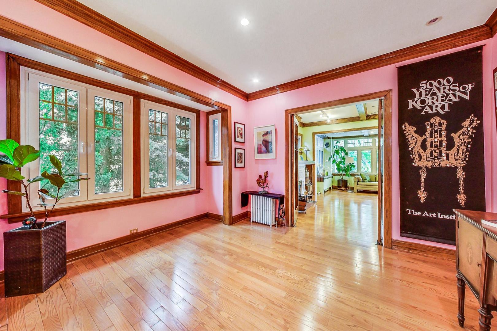 7221 North Ridge Boulevard Chicago, IL 60645 - Photo 11 of 48 a living room filled with furniture and a large window