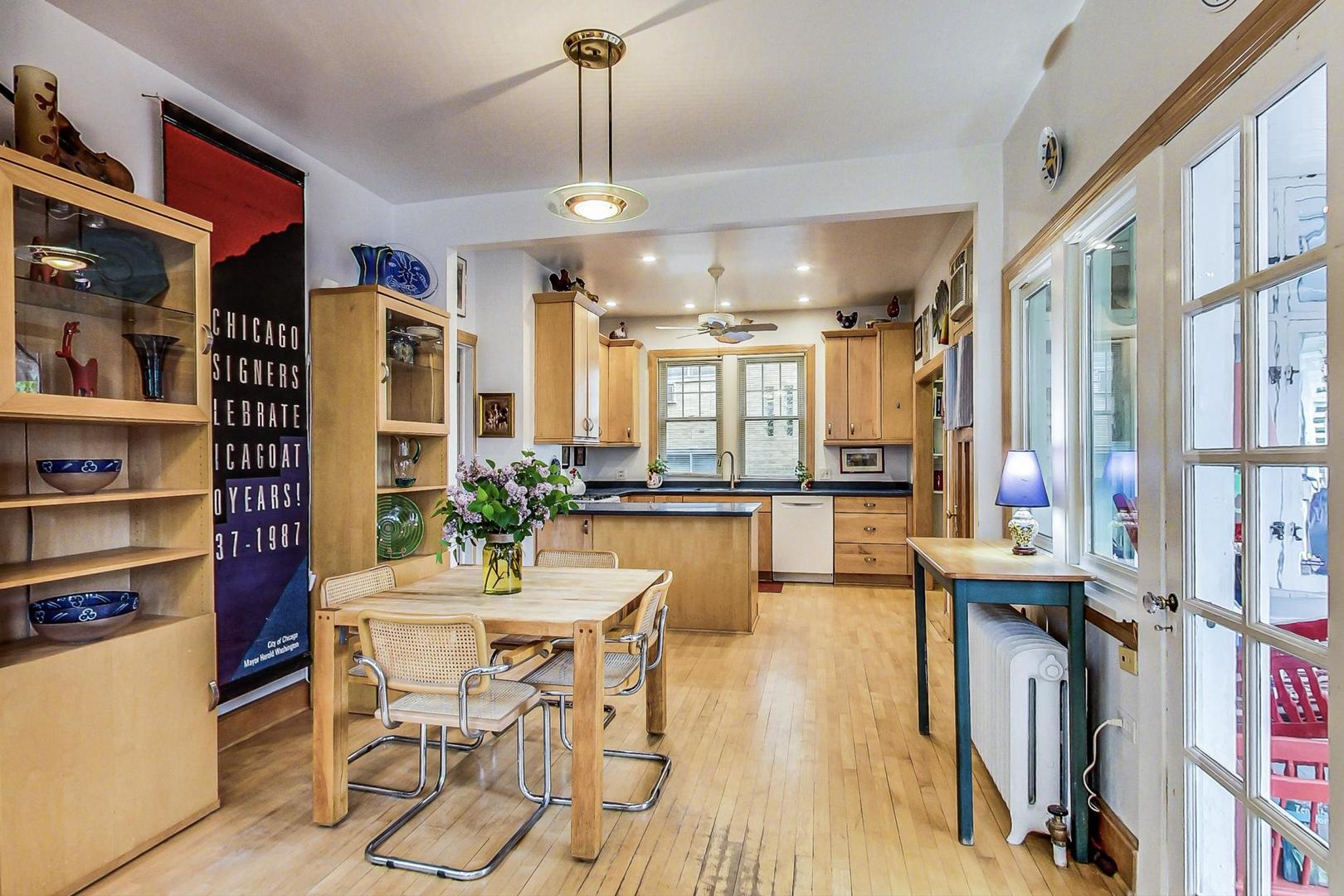 7221 North Ridge Boulevard Chicago, IL 60645 - Photo 16 of 48 a view of a dining room with furniture window and wooden floor