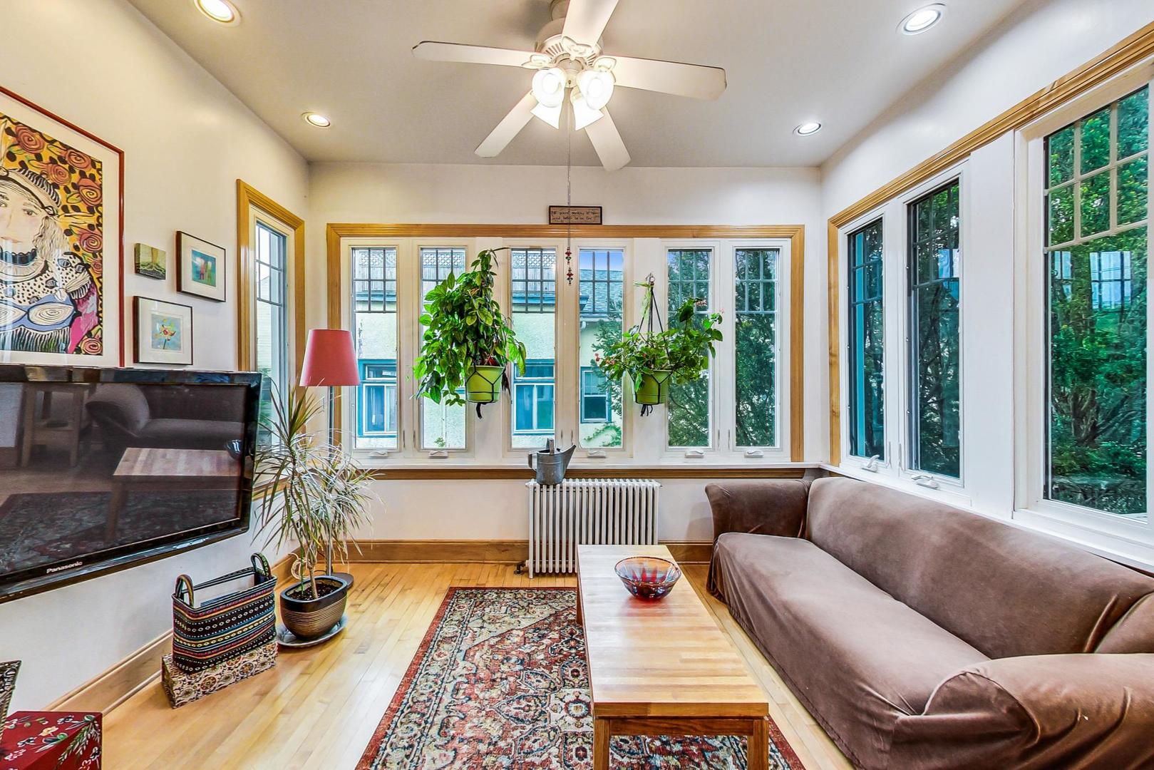 7221 North Ridge Boulevard Chicago, IL 60645 - Photo 17 of 48 a living room with furniture and a flat screen tv