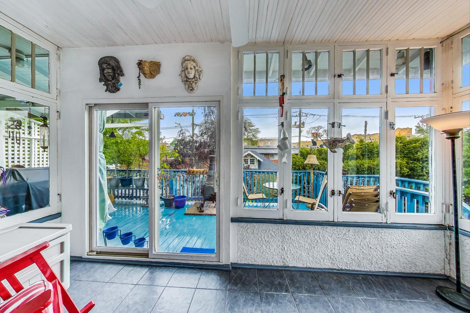 7221 North Ridge Boulevard Chicago, IL 60645 - Photo 18 of 48 a living room with fireplace furniture and floor to ceiling window