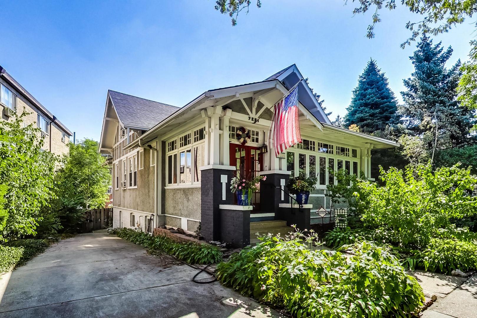 7221 North Ridge Boulevard Chicago, IL 60645 - Photo 2 of 48 a front view of house along with trees