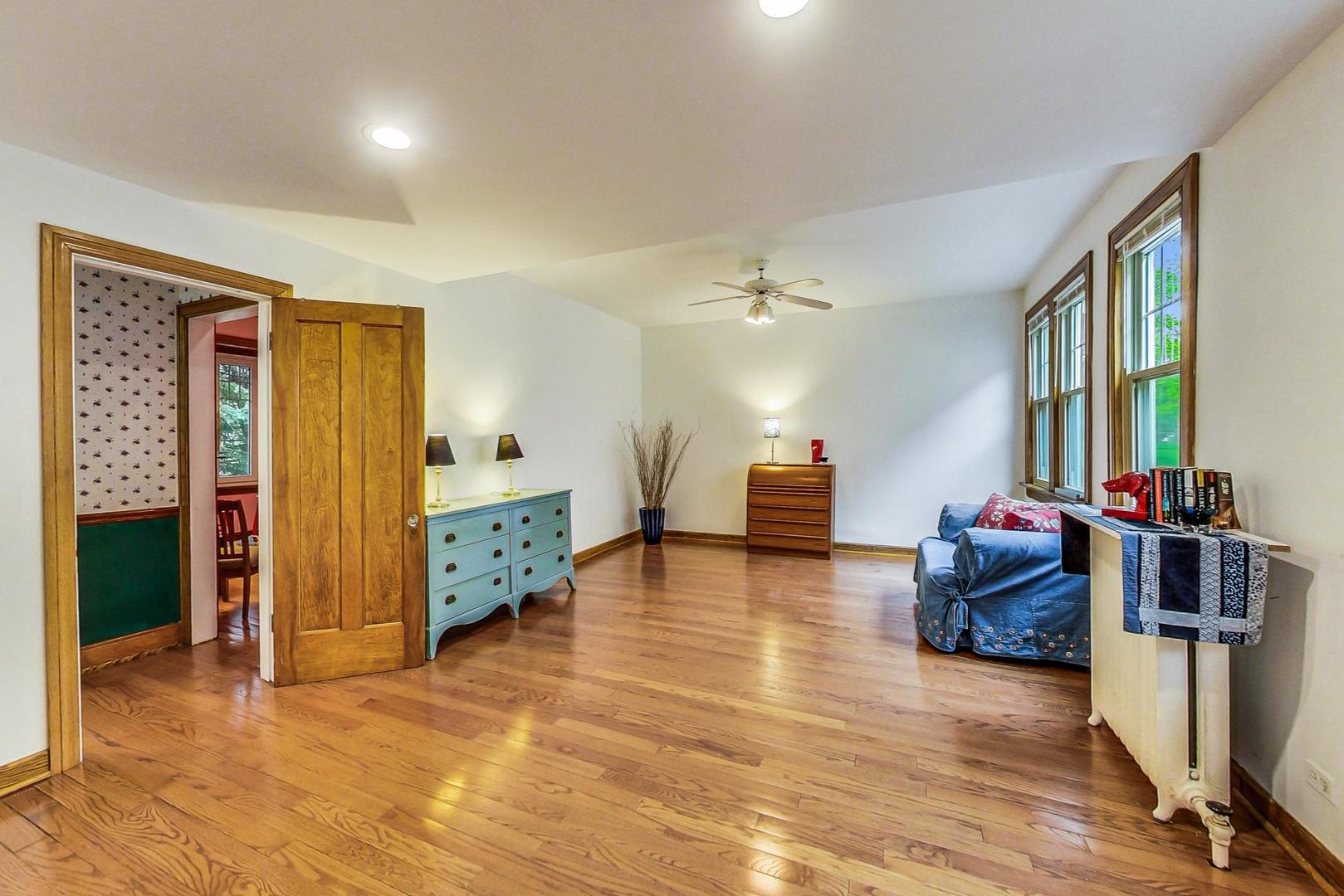7221 North Ridge Boulevard Chicago, IL 60645 - Photo 21 of 48 a living room with furniture and a wooden floor