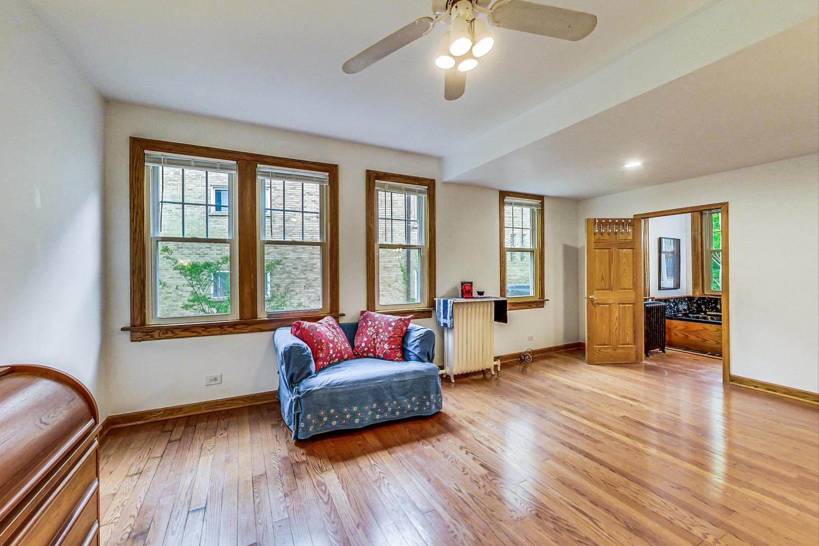7221 North Ridge Boulevard Chicago, IL 60645 - Photo 22 of 48 a living room with furniture and a large window