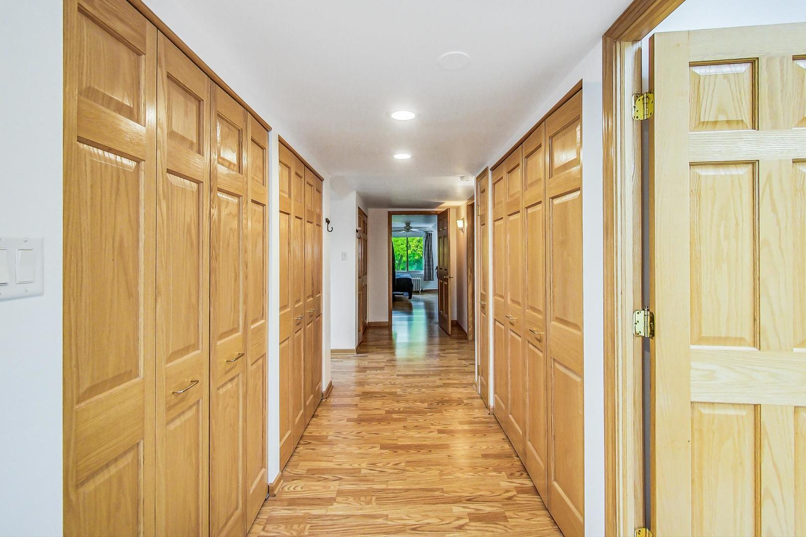 7221 North Ridge Boulevard Chicago, IL 60645 - Photo 25 of 48 a view of a hallway with wooden shelves