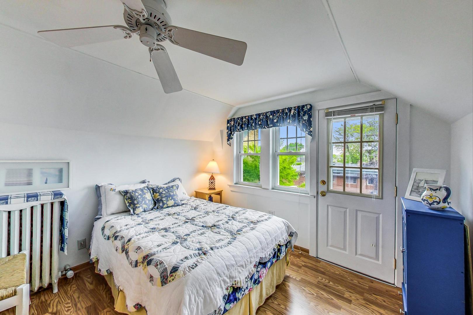 7221 North Ridge Boulevard Chicago, IL 60645 - Photo 28 of 48 a bedroom with a bed and a window