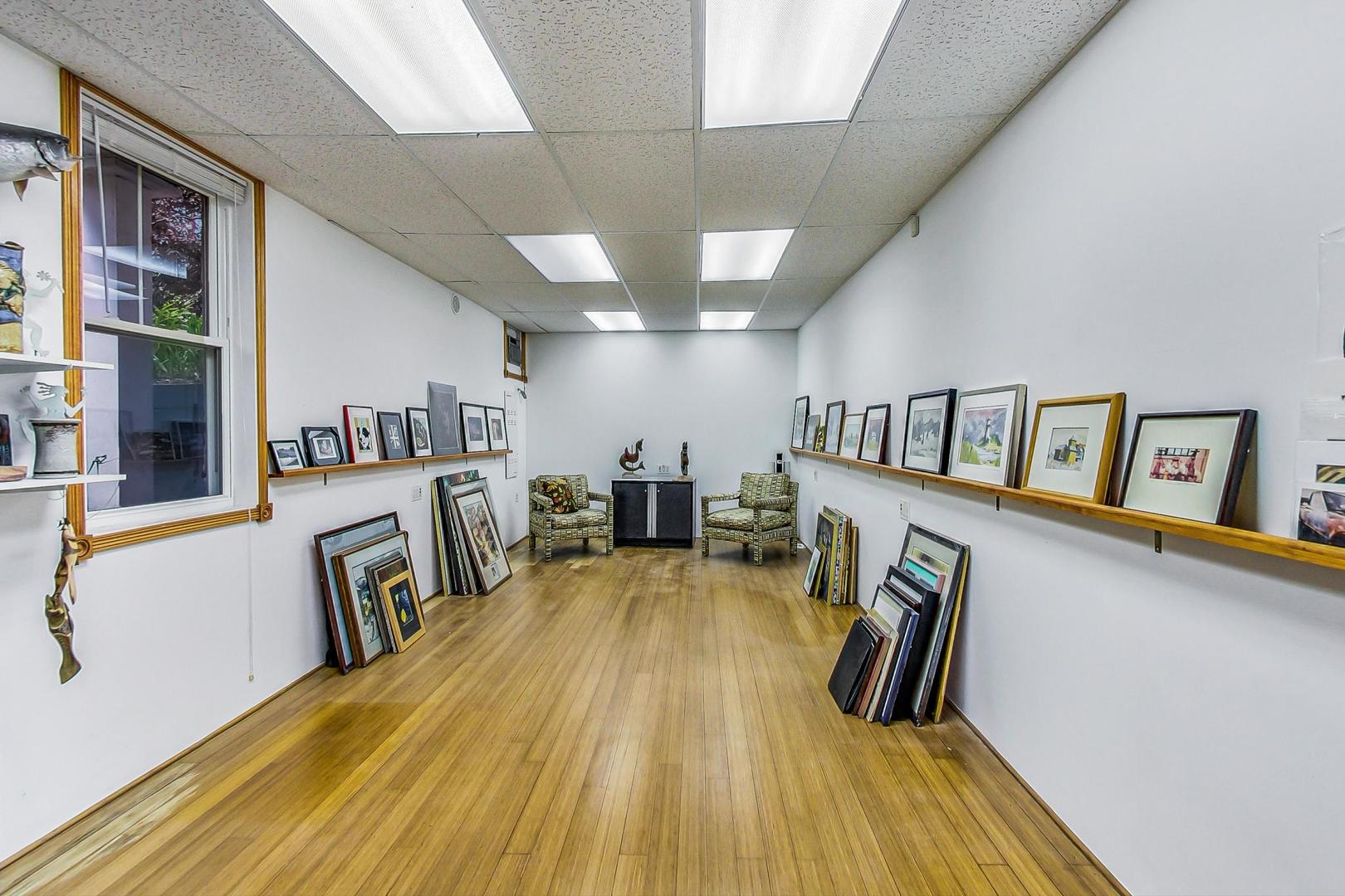 7221 North Ridge Boulevard Chicago, IL 60645 - Photo 30 of 48 a view of a living room with furniture and wooden floor