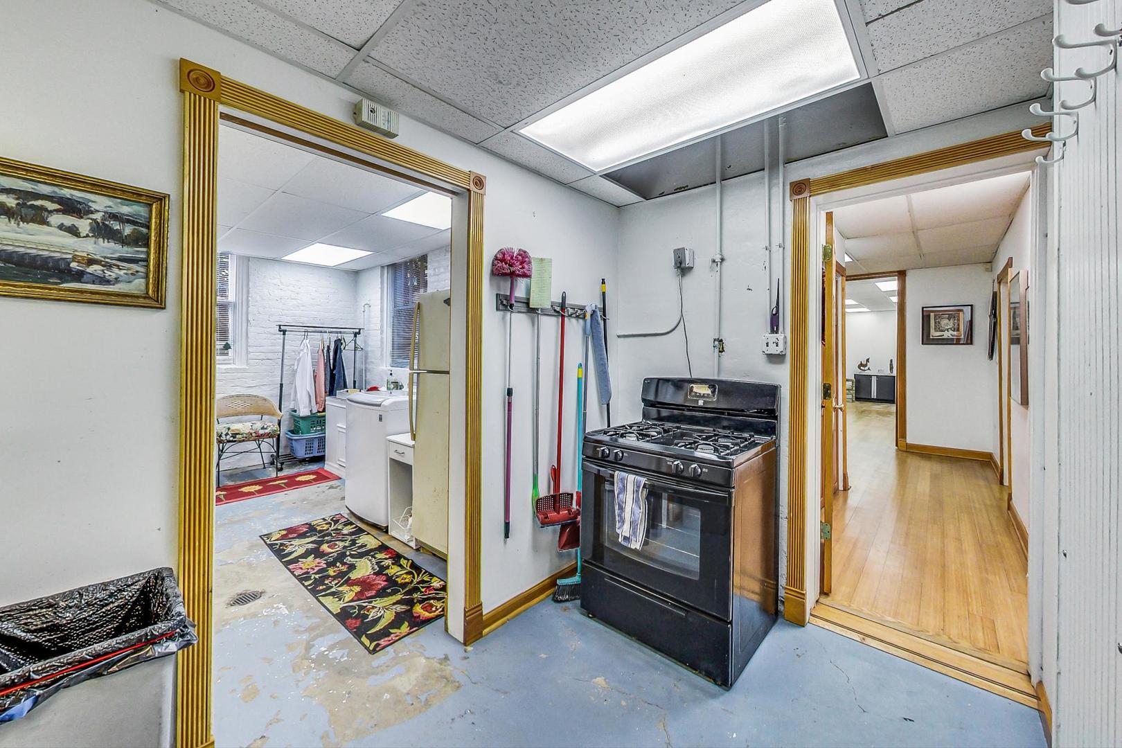 7221 North Ridge Boulevard Chicago, IL 60645 - Photo 31 of 48 a kitchen with stainless steel appliances granite countertop a stove and a refrigerator
