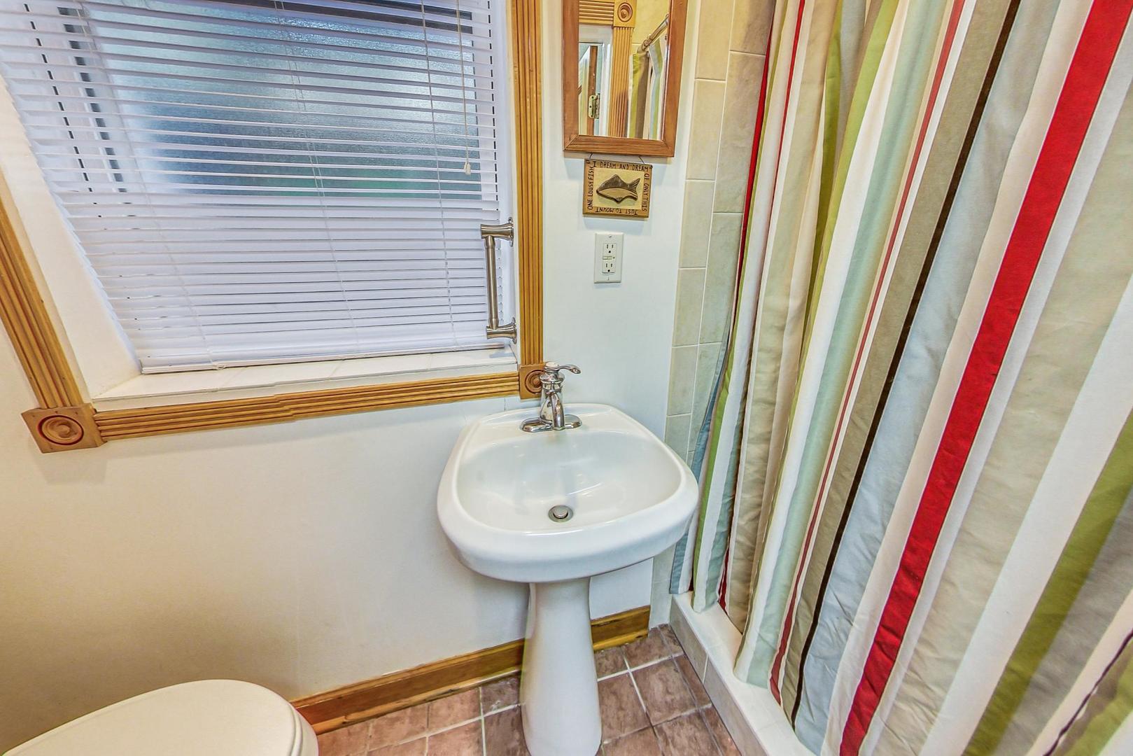 7221 North Ridge Boulevard Chicago, IL 60645 - Photo 33 of 48 a bathroom with a sink and a mirror