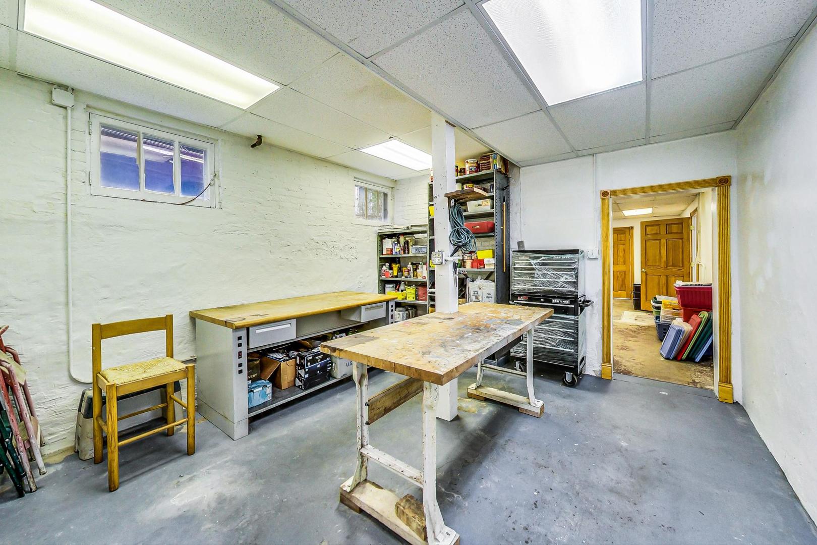 7221 North Ridge Boulevard Chicago, IL 60645 - Photo 35 of 48 a room with furniture and a table