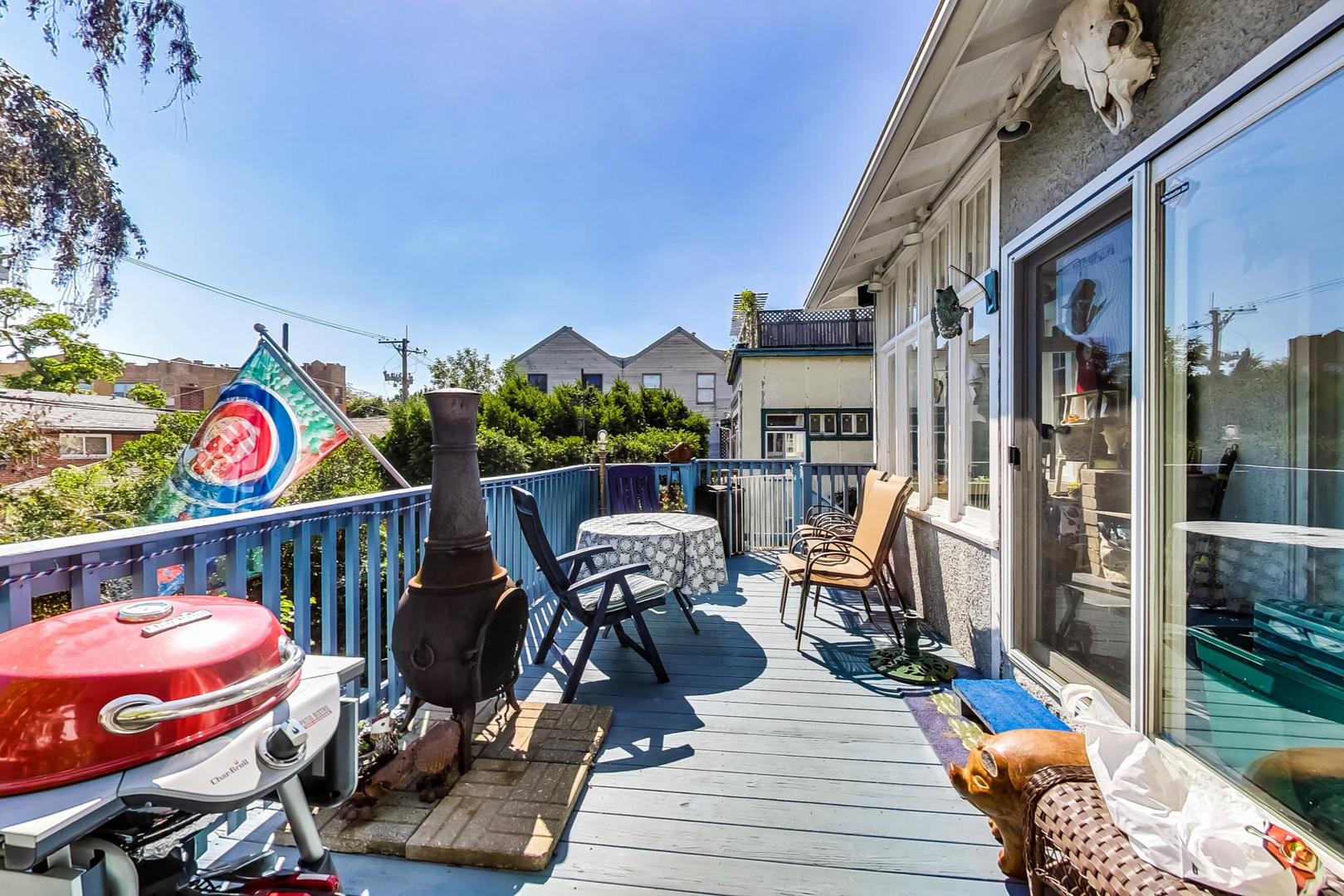 7221 North Ridge Boulevard Chicago, IL 60645 - Photo 36 of 48 a view of a chairs and table in a patio