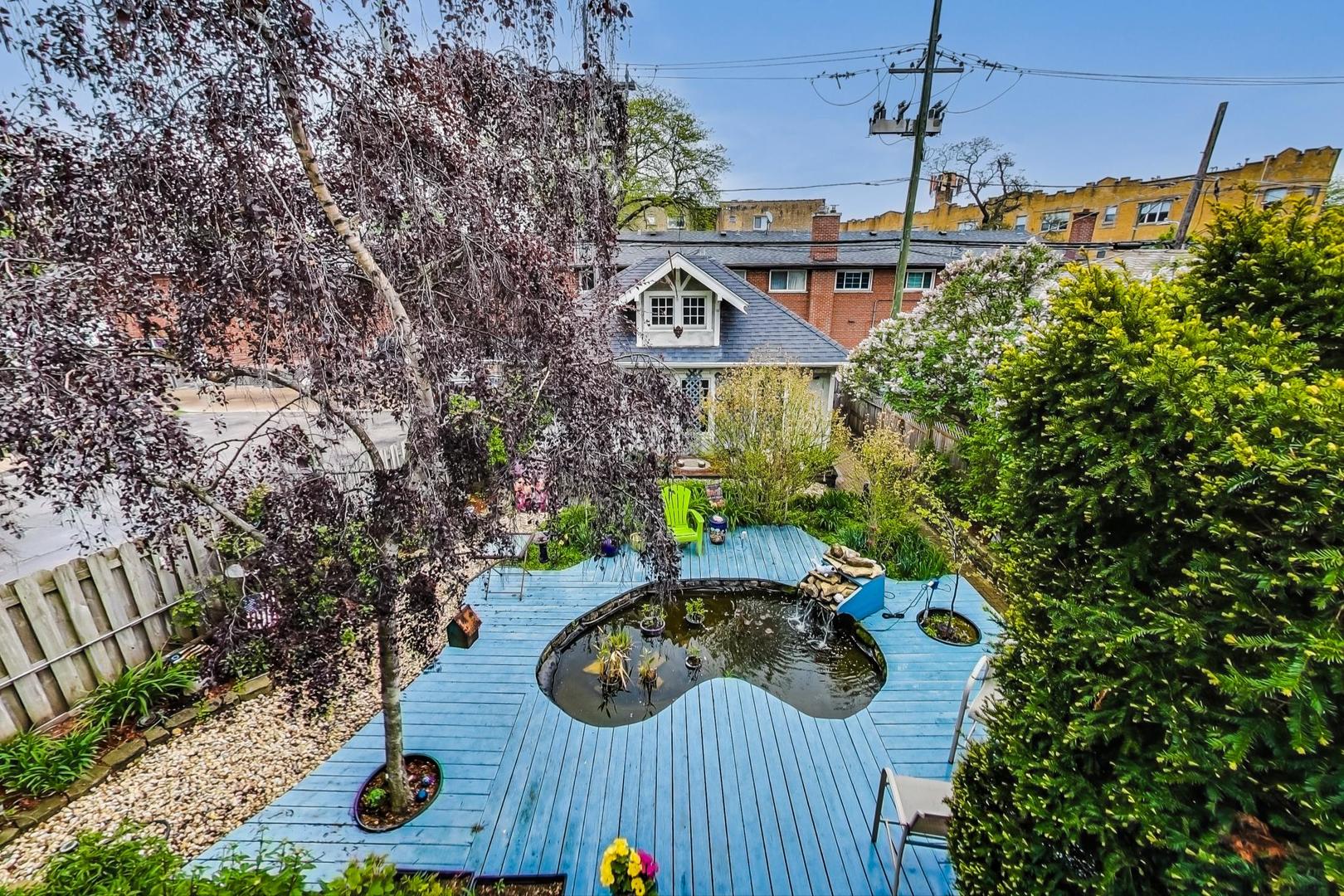 7221 North Ridge Boulevard Chicago, IL 60645 - Photo 37 of 48 a view of a house with yard and sitting area