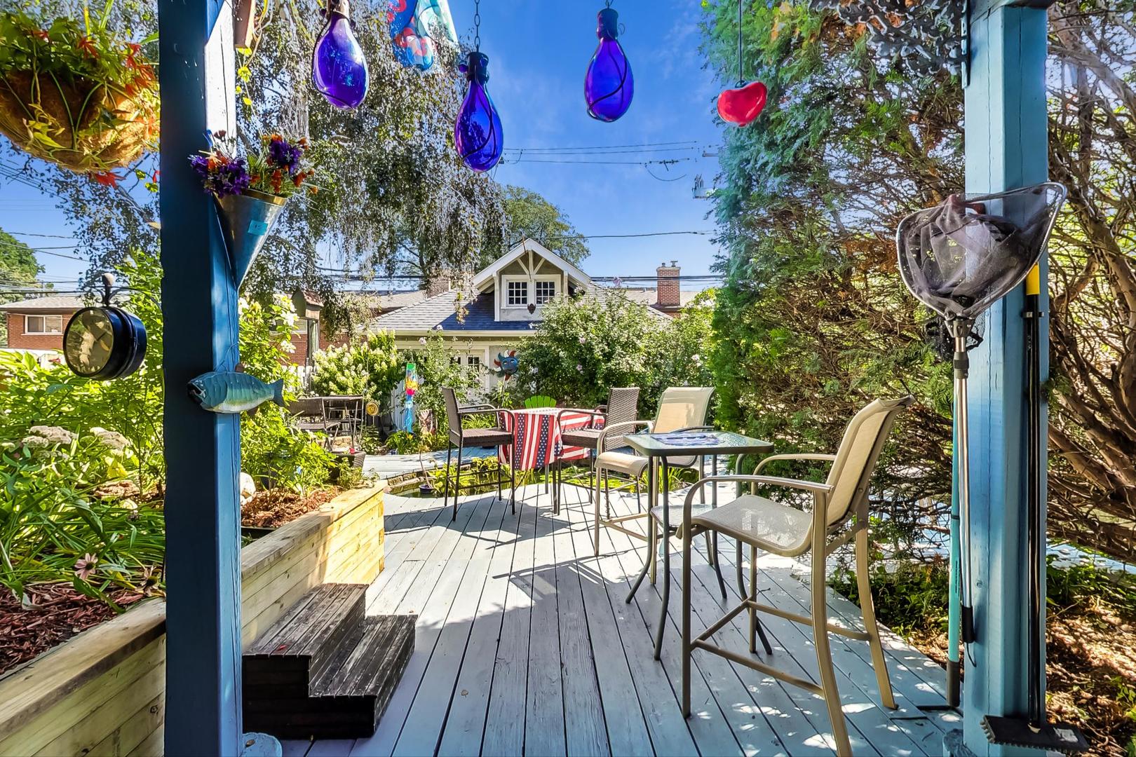7221 North Ridge Boulevard Chicago, IL 60645 - Photo 39 of 48 a view of a chairs and table in patio with a fire pit
