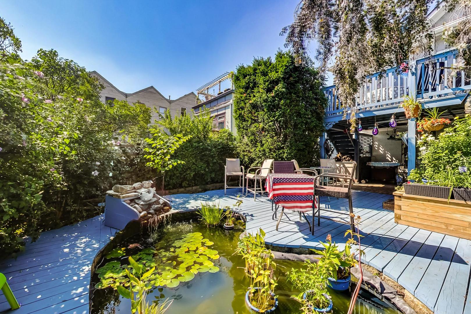 7221 North Ridge Boulevard Chicago, IL 60645 - Photo 41 of 48 a backyard of a house with table and chairs