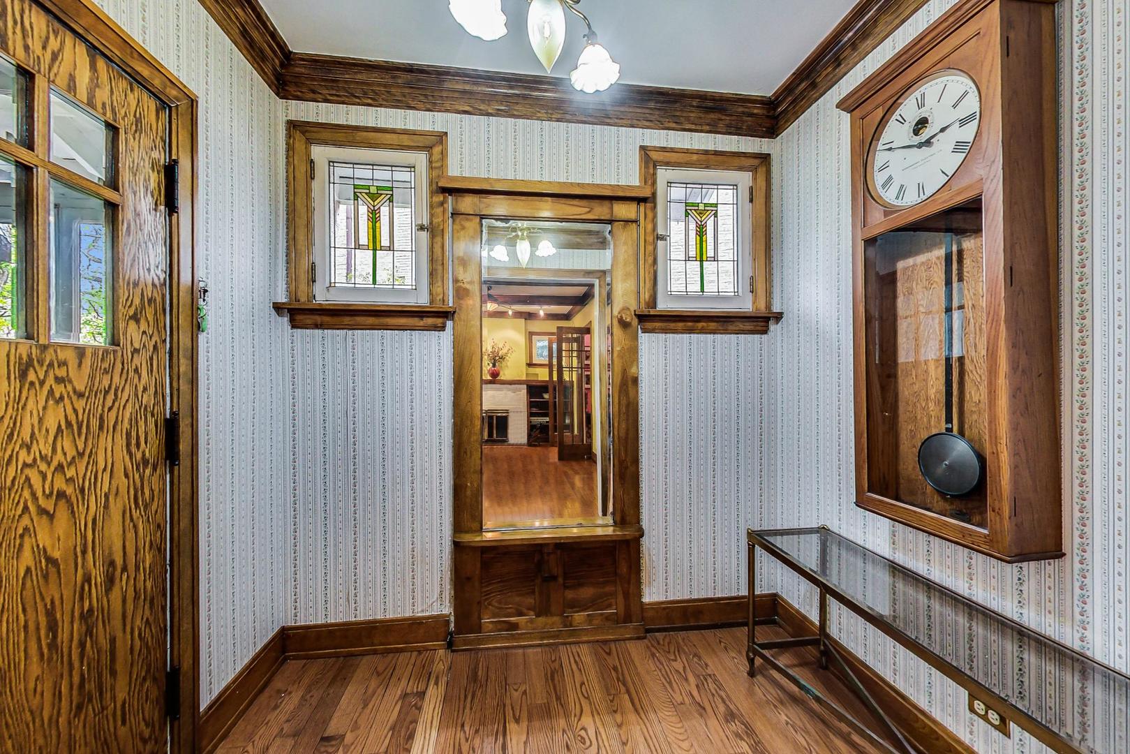7221 North Ridge Boulevard Chicago, IL 60645 - Photo 6 of 48 a view of front door with wooden floor