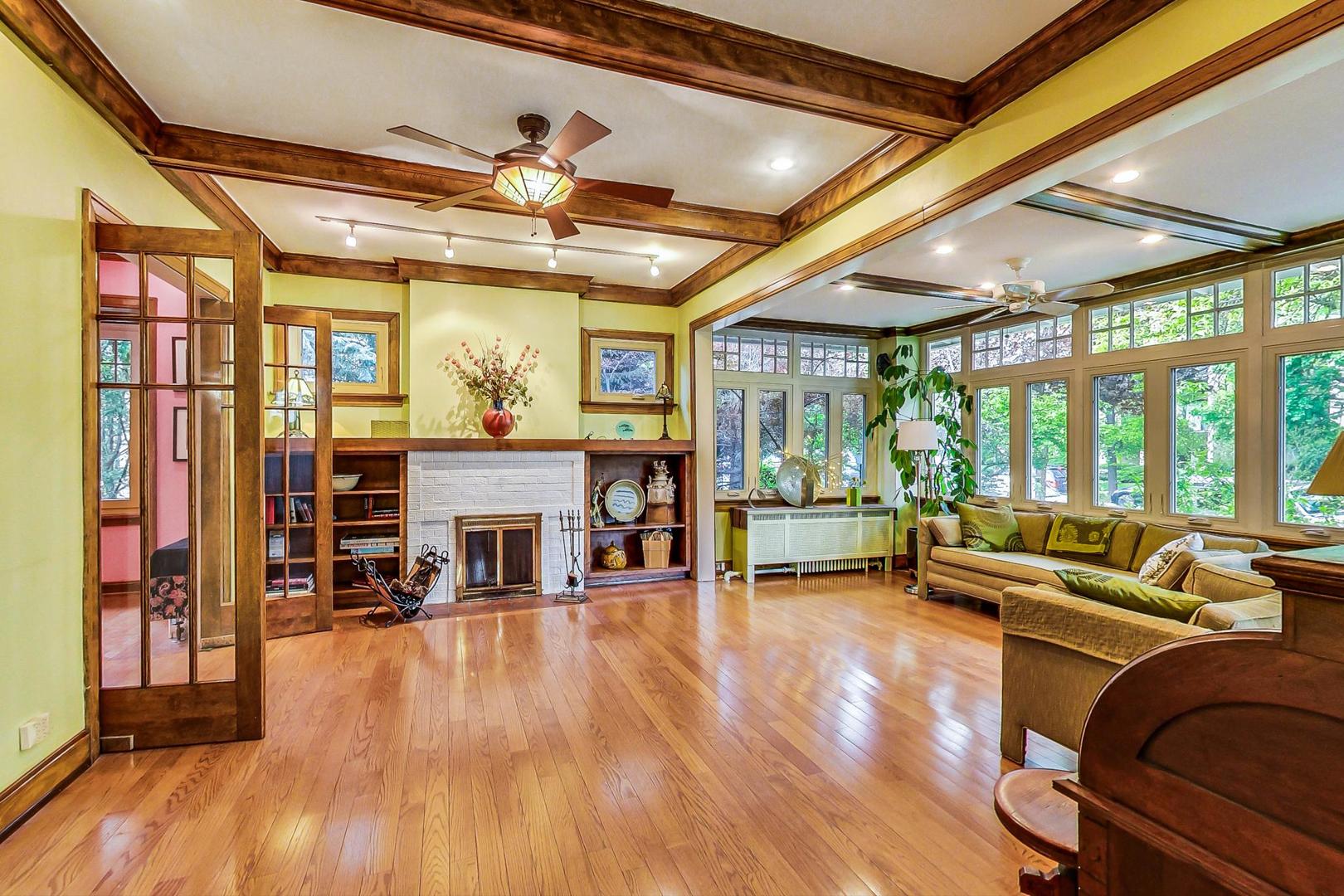 7221 North Ridge Boulevard Chicago, IL 60645 - Photo 7 of 48 a living room with furniture and a fireplace