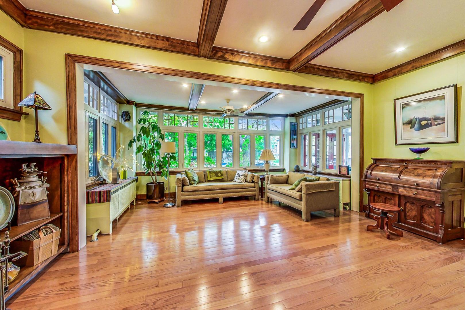 7221 North Ridge Boulevard Chicago, IL 60645 - Photo 8 of 48 a living room with furniture and a flat screen tv