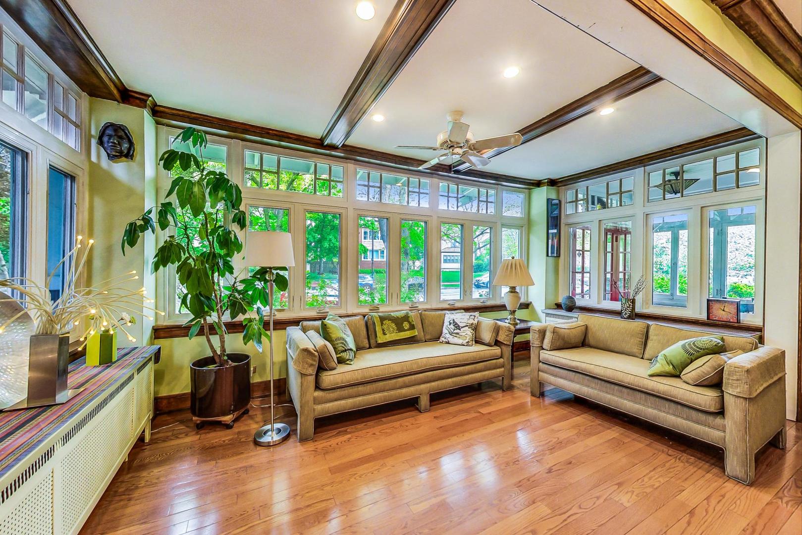 7221 North Ridge Boulevard Chicago, IL 60645 - Photo 9 of 48 a living room with furniture and a large window