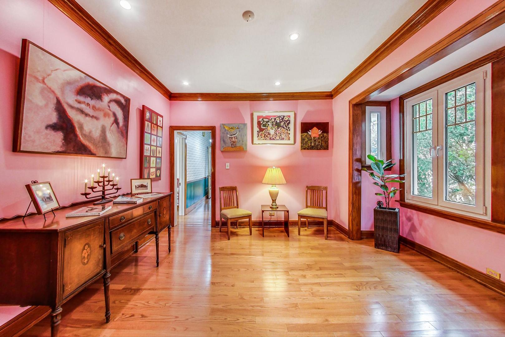 7221 North Ridge Boulevard Chicago, IL 60645 - Photo 10 of 48 a living room with furniture a rug and a large window