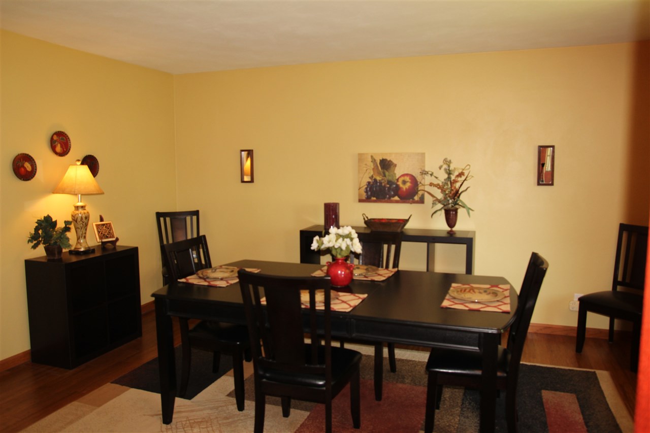 2711 Karr Road Belvidere, IL 61008 - Photo 2 of 17 a view of a dining room with furniture and wooden floor