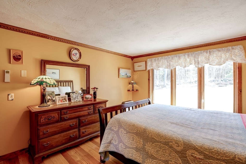 205 East Rindge Road Ashburnham, MA 01430 - Photo 32 of 40 a bedroom with a bed and a dresser