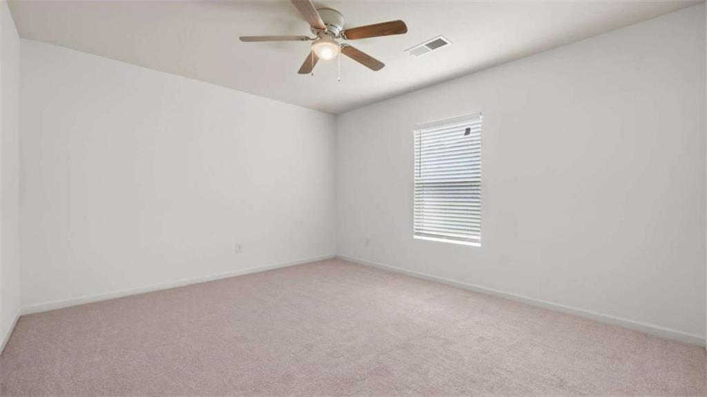 31 Southfork Drive Rome, GA 30165 - Photo 16 of 24 an empty room with a window and a fan