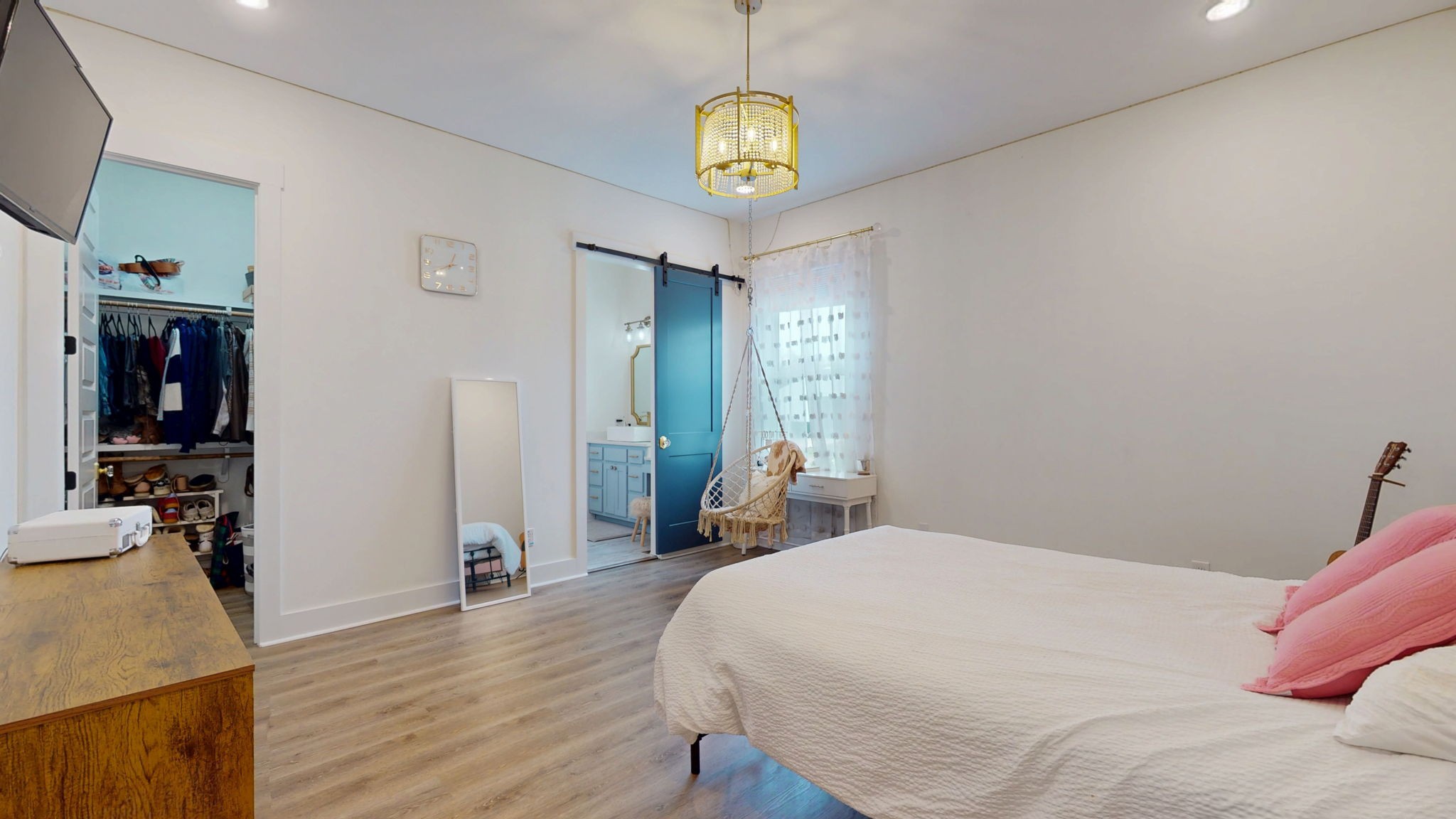 5130 Midland Road Christiana, TN 37037 - Photo 26 of 51 a bedroom with a bed and a chandelier