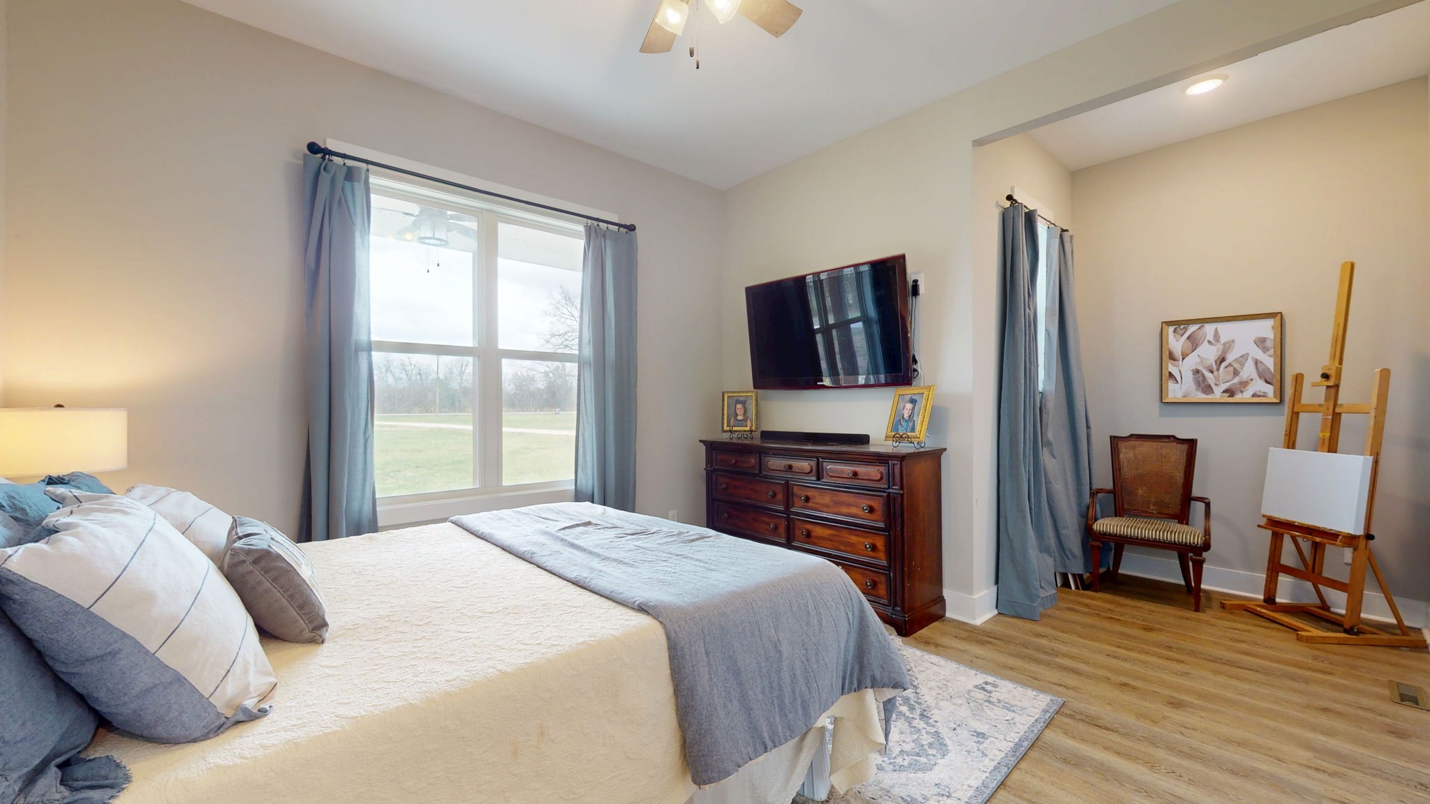 5130 Midland Road Christiana, TN 37037 - Photo 32 of 51 a bedroom with a bed and a flat screen tv