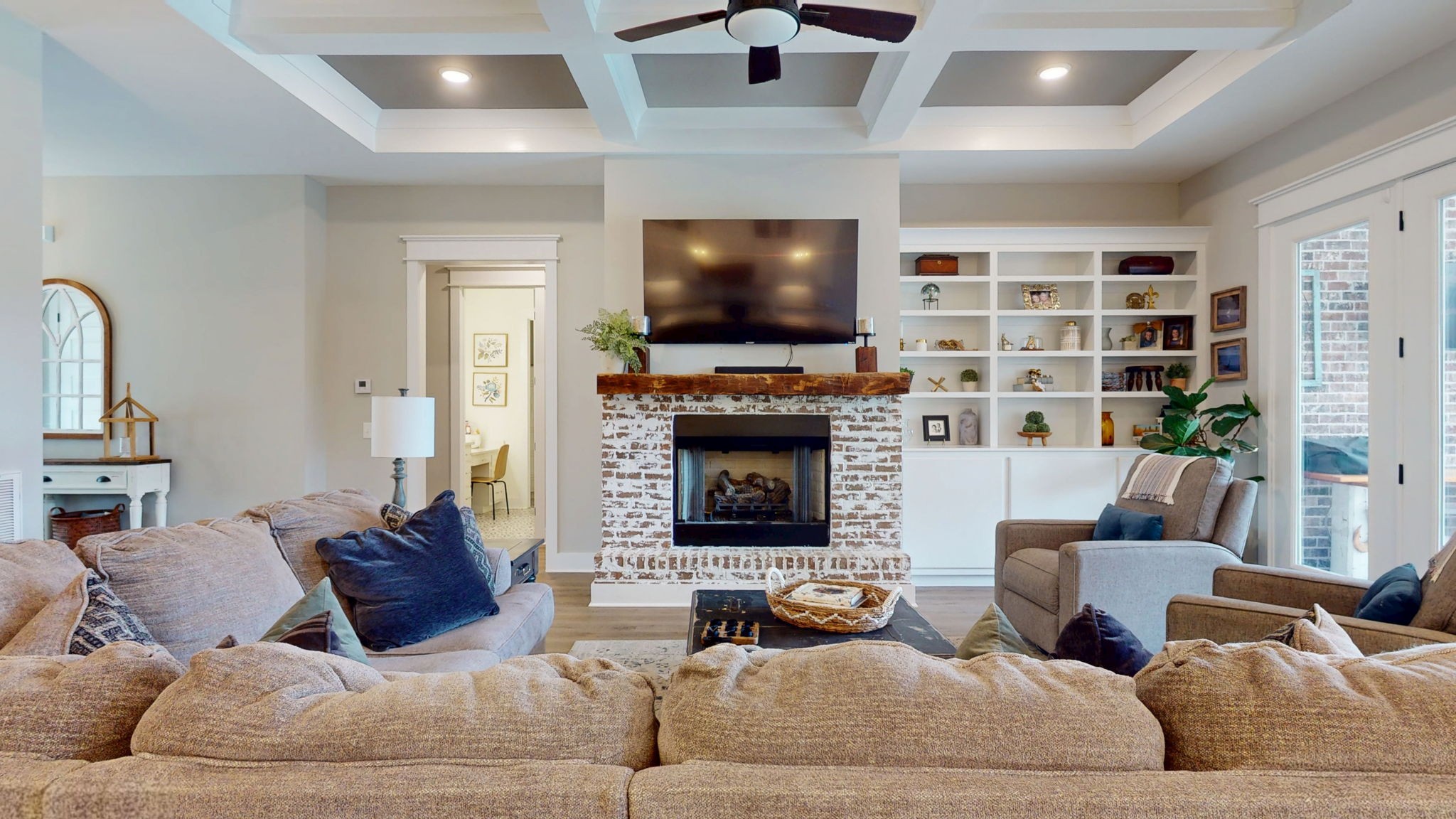 5130 Midland Road Christiana, TN 37037 - Photo 4 of 51 a living room with furniture a flat screen tv and a fireplace