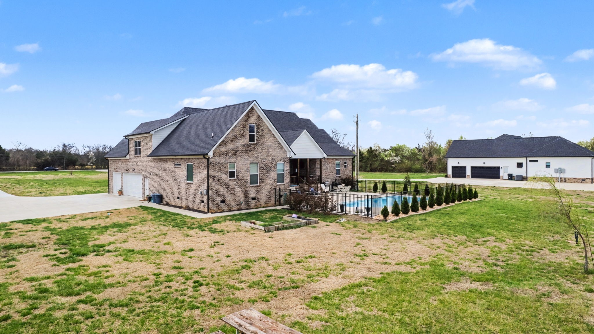 5130 Midland Road Christiana, TN 37037 - Photo 48 of 51 a view of a house with a big yard and large trees